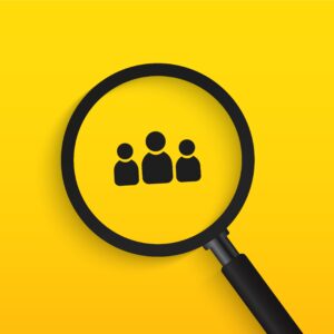 Magnifying glass hovering over three person icons on yellow gradient background
