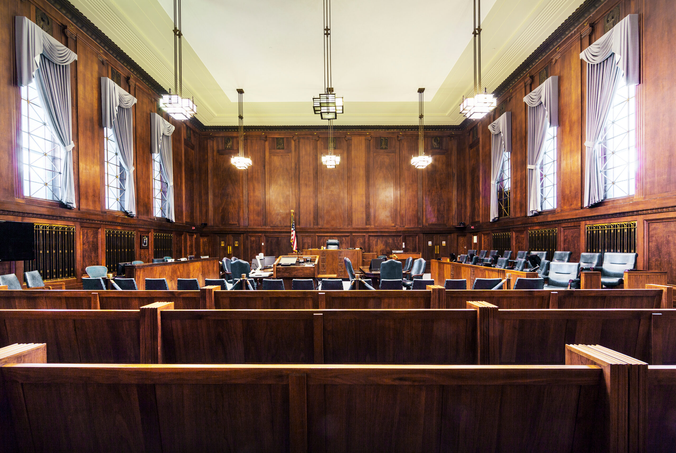 An empty courtroom viewed from the gallery